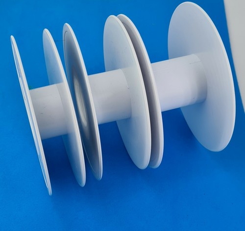 White empty ribbon spool reels - empty,